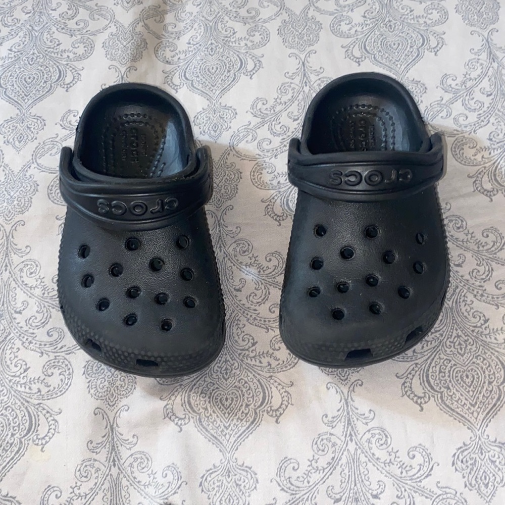 Lightly used black toddler crocs.